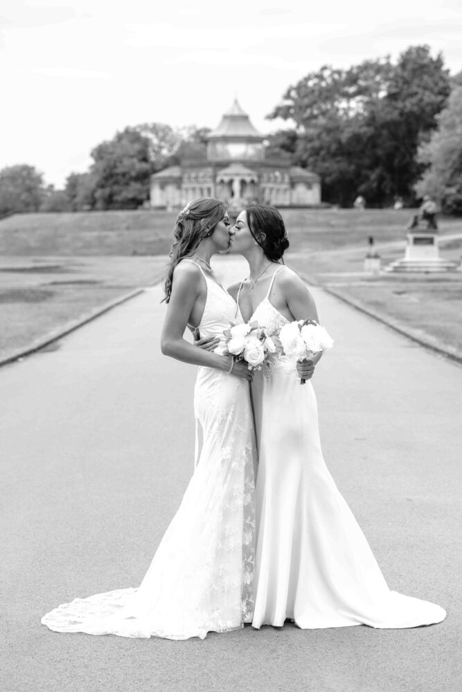 beautiful brides kissing on their wedding day 