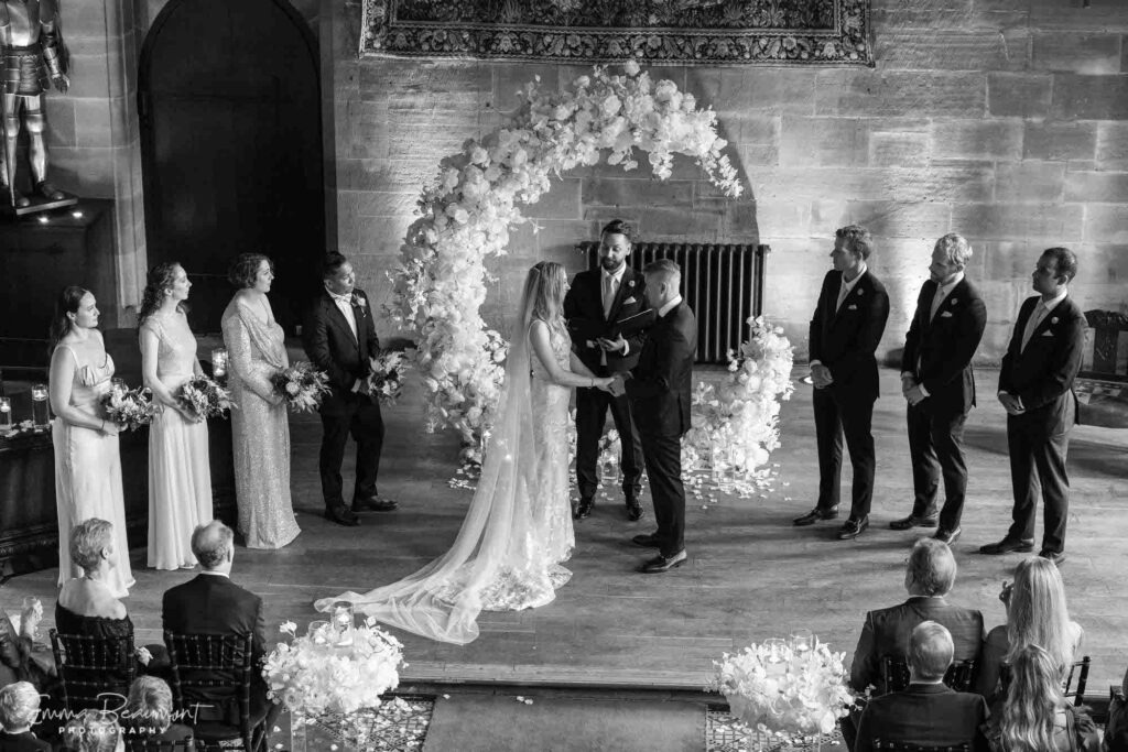 ceremony photo of couple getting married, taken from the gallery above at Peckforton Castle