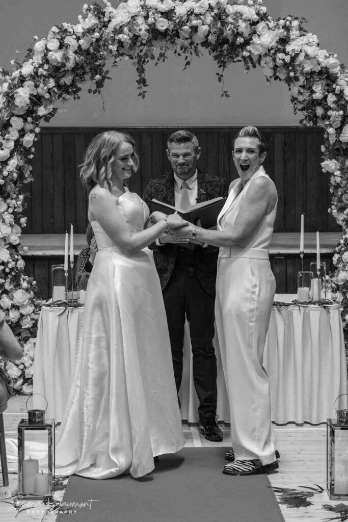 excited bride squeals during ceremony at Salford Lads Club in Manchester